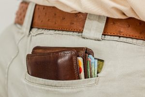 Wallet in pocket of man